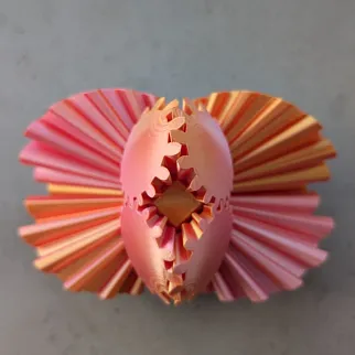 Неведомая штука круглая зубчатая розово-оранжевая