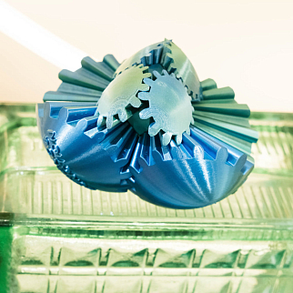 Неведомая штука круглая зубчатая бирюзовая